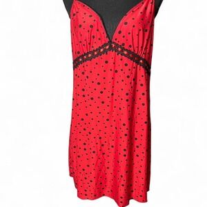 Red and black polka dot slip dress with adjustable straps and lace trim
